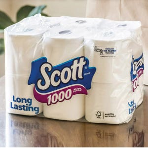 Scott brand toilet paper with the label \“1000 sheets per roll\“ and \“Long Lasting\“ prominently displayed on the packaging.
