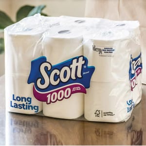 Scott brand toilet paper with the label \“1000 sheets per roll\“ and \“Long Lasting\“ prominently displayed on the packaging.