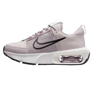 A lavender Nike Air Max INTRLK sneaker with a black Swoosh, featuring a visible air unit in the midsole, mesh and synthetic upper, and a white and black rubber outsole.