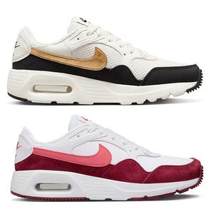 Two pairs of Nike Air Max 90 sneakers, one with white and black with a golden swoosh, the other white with red overlays.