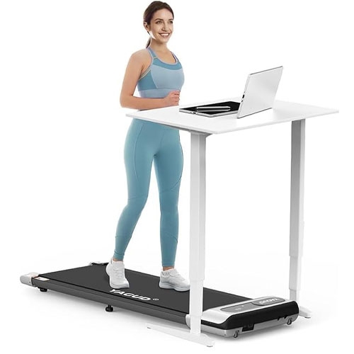 a person with brown hair wearing a blue workout outfit on a walking pad treadmill