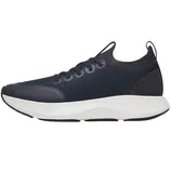A navy athletic shoe with a textured upper and white cushioned sole, featuring laces and a pull tab at the heel.