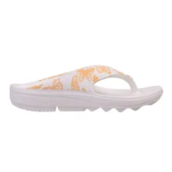 White flip-flop sandal with orange butterfly print, featuring a thick sole and zigzag tread for grip.
