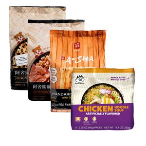 The 18pk A-Sha Ramen Variety Pack includes a selection of different noodle flavors like Hakka Sesame, Spicy Fennel, Mandarin with Olive Oil, and Prince Katsu Chicken Noodle Soup, with each flavor packaged individually.
