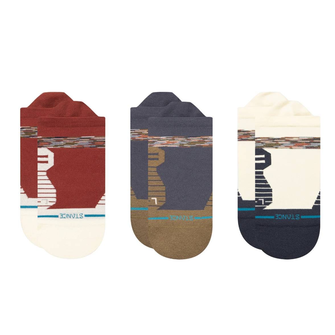 Three pairs of colorful, patterned ankle socks featuring abstract designs in red, blue, and beige tones, each with \“STANCE\“ text near the cuff.
