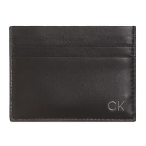 A sleek black leather cardholder featuring a minimalist design with three card slots and the \“CK\“ logo embossed in the lower right corner.