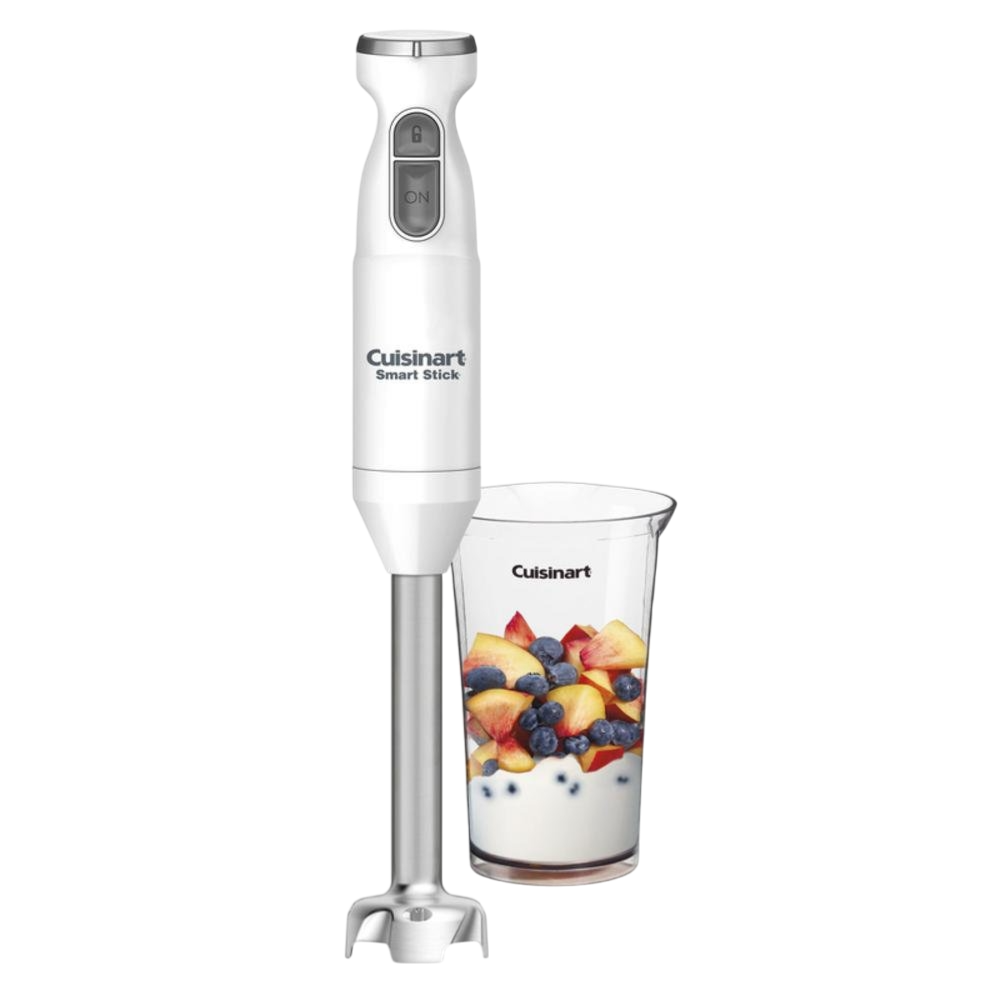 A Cuisinart Smart Stick hand blender with a stainless-steel blade is shown next to a transparent cup containing yogurt, peaches, and blueberries.