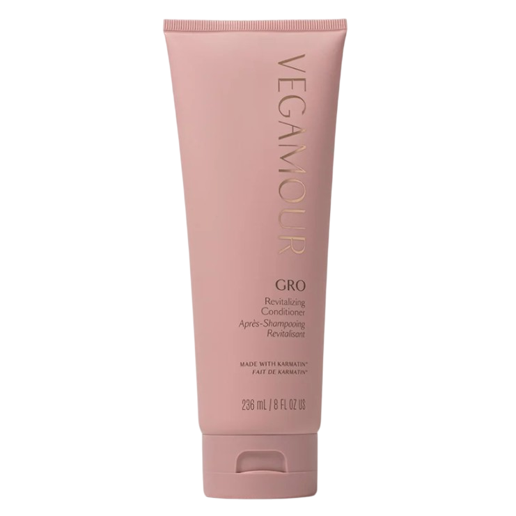 VEGAMOUR GRO Revitalizing Conditioner, made with Karmatin, comes in a pink 236 mL (8 fl oz) bottle.