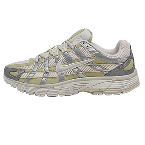 Nike P-6000 Casual Shoes feature a mesh and synthetic upper with a combination of neutral tones including beige and light green, accented by silver overlays. The design blends retro running styles with modern aesthetics, suitable for everyday wear.