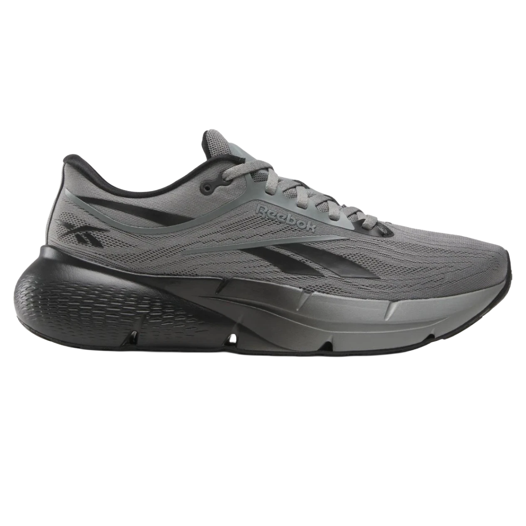 Gray Reebok running shoe with a thick, cushioned sole and black accents, featuring the Reebok logo on the side.