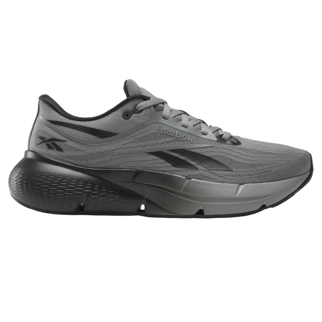 Gray Reebok running shoe with a thick, cushioned sole and black accents, featuring the Reebok logo on the side.