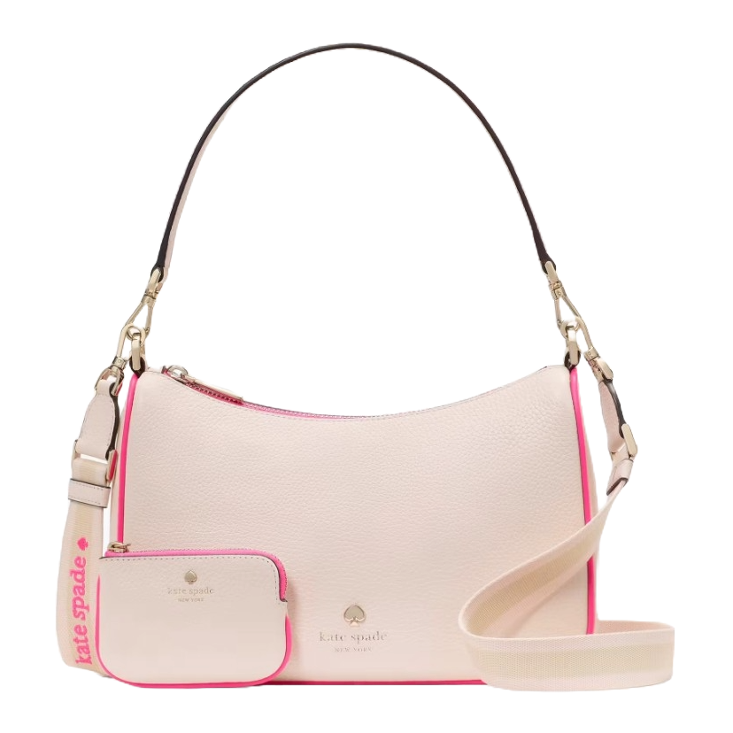 Cream handbag with neon pink trim, featuring a detachable shoulder strap and matching coin purse. The brand \“Kate Spade New York\“ is visible on both items.
