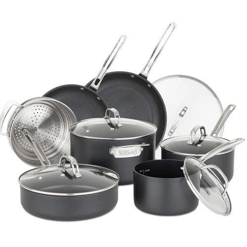 A set of non-stick cookware featuring various pots and pans with glass lids and stainless steel handles, including a steamer insert.