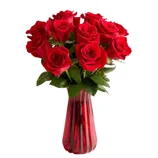 A bouquet of red roses arranged in a red vase, accompanied by a \“Save 15%\“ label.