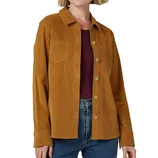 A woman is wearing a mustard-colored corduroy shirt with button closure and chest pockets, paired with blue jeans and a maroon top underneath.