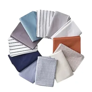 Assorted bed sheets in various colors and patterns, arranged in a circular pattern.