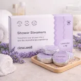 Shower steamers with lavender scent by dew.well, designed to create an aromatherapy experience. The package contains 15 tablets and highlights the use of essential oils for stress relief.