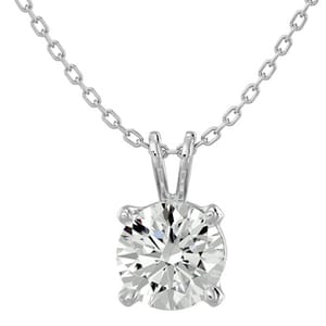A silver chain necklace with a solitaire round-cut diamond pendant set in a four-prong mount.