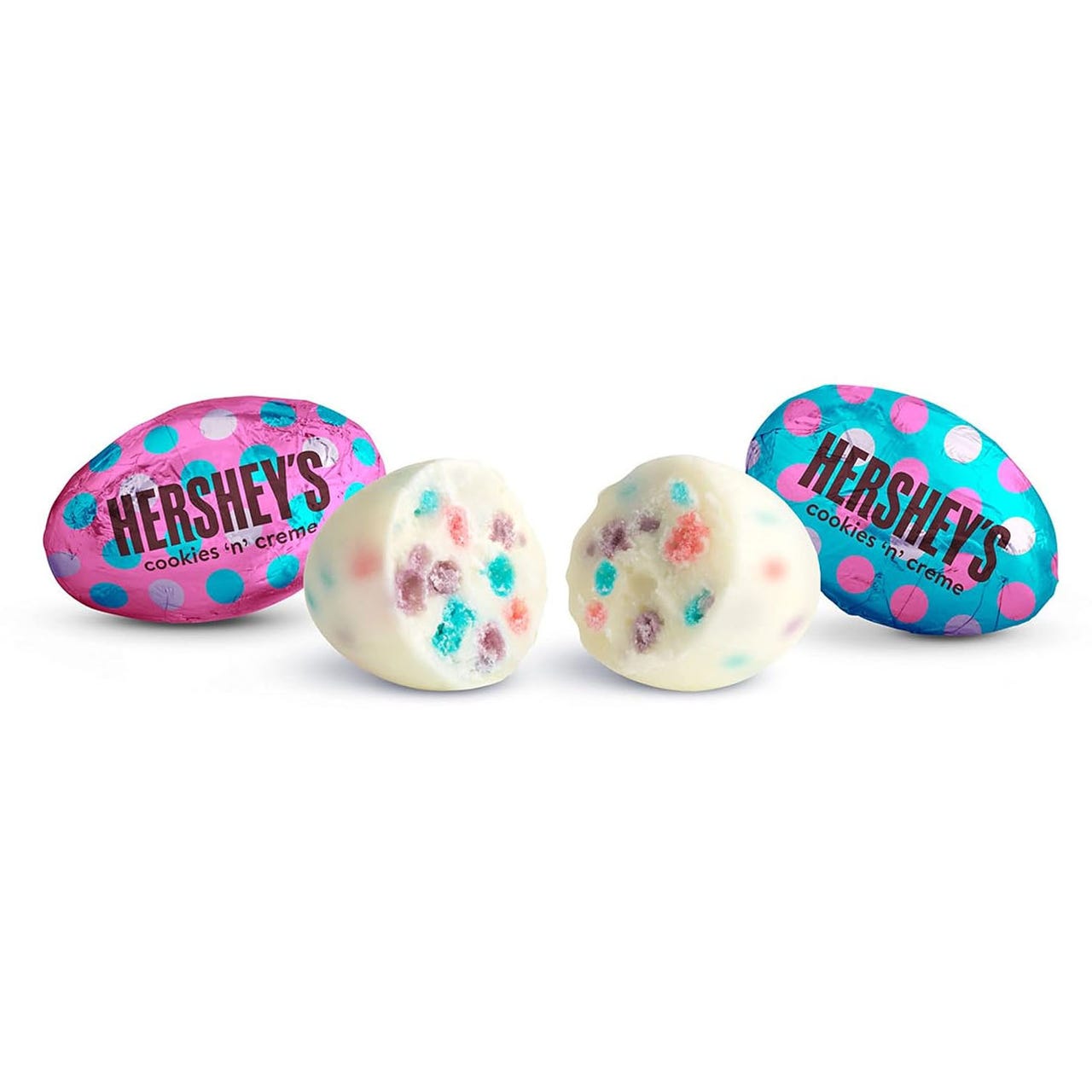 Hershey's Cookies 'n' Creme Eggs are white chocolate eggs with colorful cookie pieces inside, wrapped in pink and blue foil with polka dots.