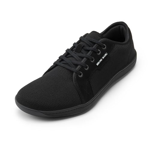 Black Bruno Marc sneakers with a canvas upper, lace-up closure, and a flat rubber sole.
