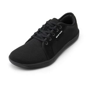 Black Bruno Marc sneakers with a canvas upper, lace-up closure, and a flat rubber sole.