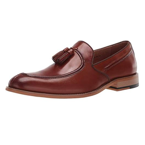 Brown leather loafer with tassels and a low stacked heel.