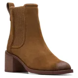 A brown suede Chelsea boot with a block heel and elastic side panels.