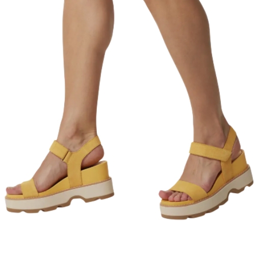 Yellow Sorel Strap Wedge Sandals feature a chunky platform sole, open toe, and adjustable ankle straps for support.