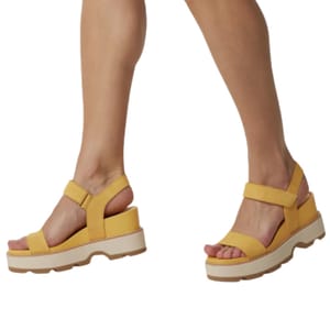 Yellow Sorel Strap Wedge Sandals feature a chunky platform sole, open toe, and adjustable ankle straps for support.