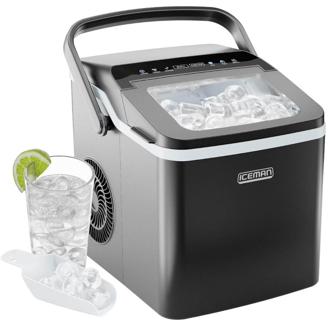 A compact countertop ice maker labeled \“Iceman\“ with a transparent lid showing ice cubes, accompanied by a scoop, and a glass filled with ice and a lime slice.