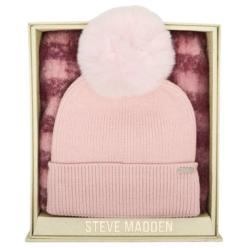 Steve Madden gift set featuring a pink knit beanie with a large pom-pom and a matching checkered scarf, presented in a gold-edged box.