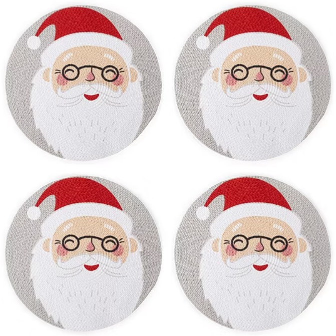Four circular coasters feature a cute Santa Claus design with a red hat, glasses, and a white beard, set against a gray background.