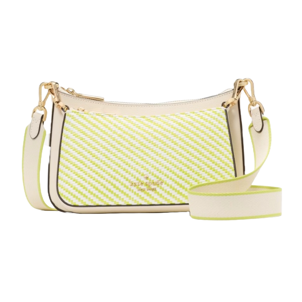 The Kate Spade Duet Straw Crossbody features a diagonal green and white straw pattern with a cream strap and gold hardware. It's a compact, stylish bag designed for easy, casual wear.
