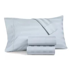 Light blue striped bed sheet set, including two folded sheets and a pillowcase.