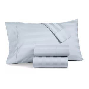 Light blue striped bed sheet set, including two folded sheets and a pillowcase.