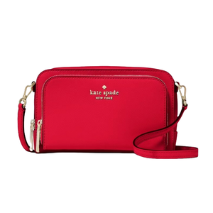 A red Kate Spade New York crossbody bag with gold hardware and a front zip pocket.