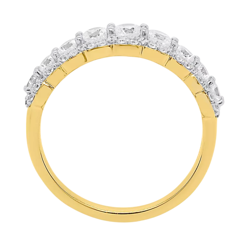 A gold band ring featuring a row of round, clear stones set along the upper half.