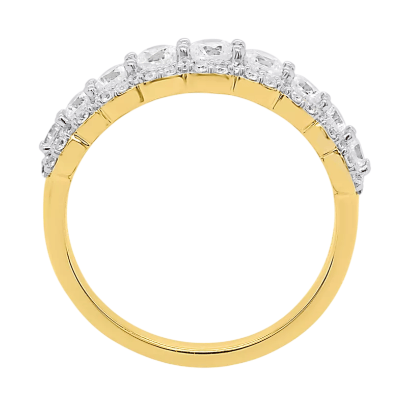 A gold band ring featuring a row of round, clear stones set along the upper half.