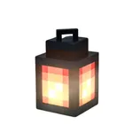 A pixelated-style lantern emits a warm glow on sandy terrain, resembling a design commonly seen in video games like Minecraft.
