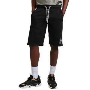 Black fleece shorts with a drawstring waistband featuring white text. The shorts have a small logo patch on the left leg and are paired with white socks and black sneakers with gold accents.