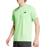 A light green athletic t-shirt with a black logo on the chest, paired with dark shorts.