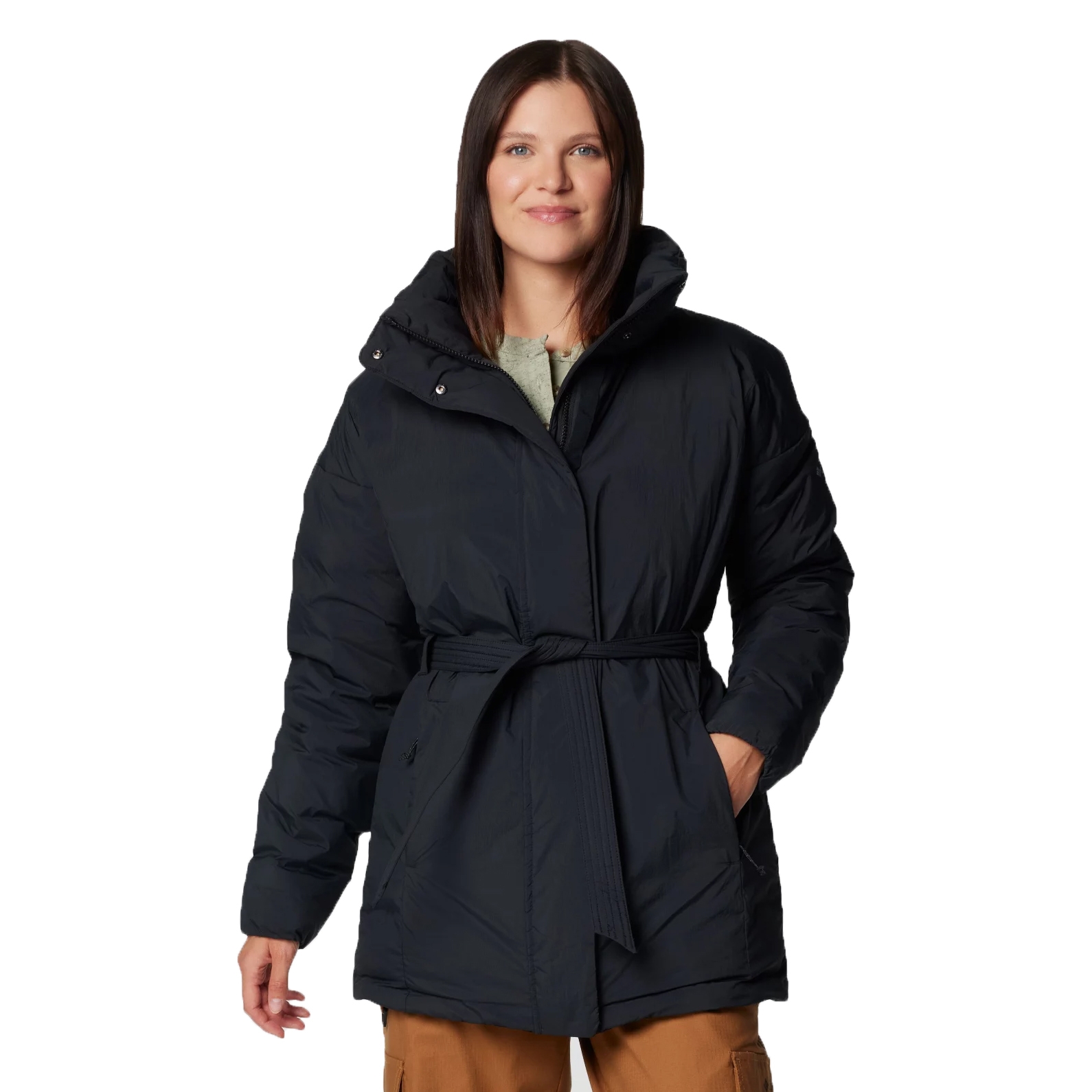 A person is wearing a black belted puffer jacket with a hood and brown pants.