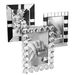 Three decorative photo frames with unique black and clear designs; one frame is adorned with circular accents, capturing elegant wedding-themed images.