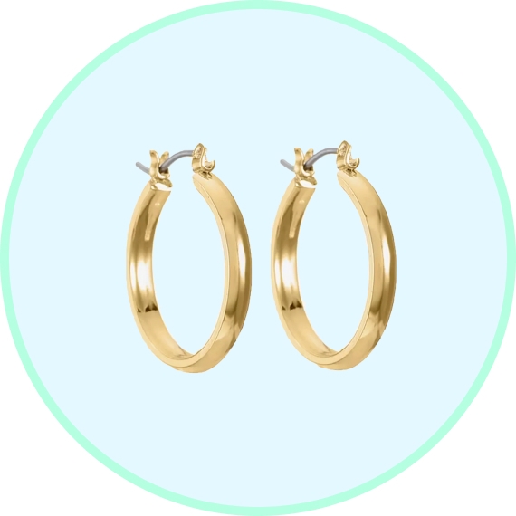 A pair of gold hoop earrings on a light blue background.