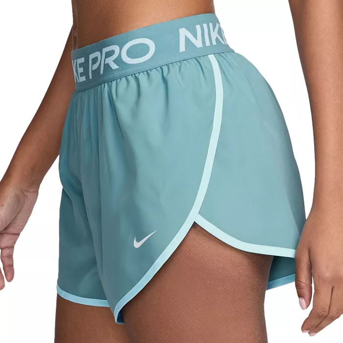 Light blue Nike Pro athletic shorts featuring an elastic waistband with the Nike logo and a small Nike swoosh near the hem.