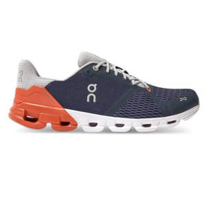A running shoe with a navy blue mesh upper, orange and white cushioned outsole, featuring the brand's logo.