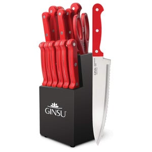 12-piece Ginsu knife set with red handles, includes various knives and scissors, displayed in a black knife block.