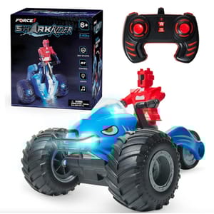 A blue and red remote-controlled toy car with shark elements and oversized rubber wheels, accompanied by a black and red two-joystick remote control.