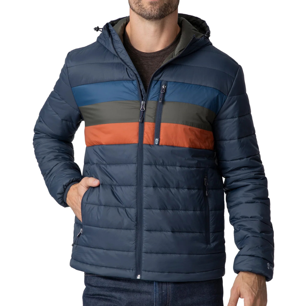 A man wears a hooded, quilted jacket with horizontal stripes in blue, green, and orange.