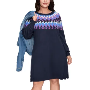 Navy sweater dress with colorful geometric patterns on the chest and sleeves, paired with a blue denim jacket draped over the shoulder.